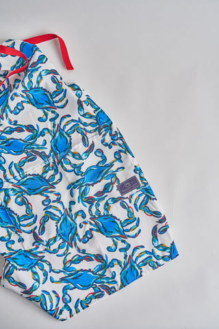 The Crab Craze Apron features exclusive Sewing Down South patterns. Adorned with a vibrant blue crab and red accents, its multicolored ropes intertwine seamlessly, adding a unique touch to your kitchen essentials.