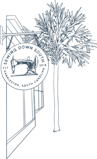Line drawing of a storefront with a hanging sign that reads “Sewing Down South,” featuring a vintage sewing machine, and a palm tree in the background. The text also notes Charleston, South Carolina, est. 2018.
