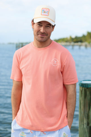 Craig wearing Crown & Ivy shirt in a coastal setting.
