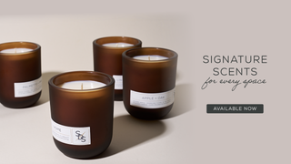 Four brown candles with labels on a light background, featuring the text 'Signature Scents for every space'.