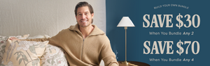 A smiling man in a tan sweater sits on a floral-patterned couch next to a lamp. Text on a blue background reads: Save $30 when you bundle any 2, Save $70 when you bundle any 4. Build your own bundle.