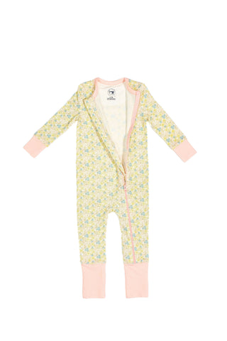 The Precious Petals Dream & Play Zipper Romper features a floral print, long sleeves, pink cuffs, and a diagonal pink zipper. Made from cotton modal for stylish comfort for your little one.