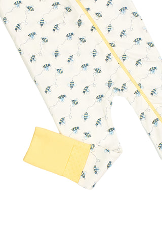 Buzzin’ Around Dream & Play Zipper Romper with blue and yellow bee print, vibrant yellow zipper, and a sleeve cuff folded to reveal a solid yellow interior.