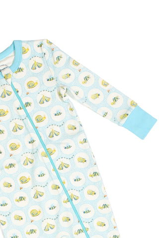 Light blue and white Buggin’ Out Dream & Play Zipper Romper with long sleeves, front zipper, blue cuffs, and a playful pattern of circus animals and tents inside circular frames.