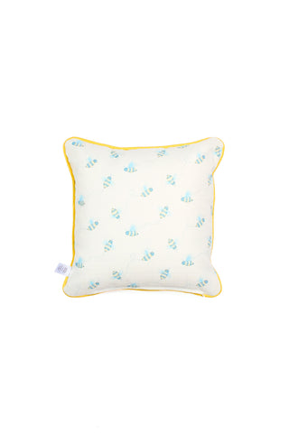 Buzzin’ Around Children’s Pillow: White pillow with yellow piping and a blue bee print pattern, ideal for nursery or kids’ decor. Shown on a plain white background.