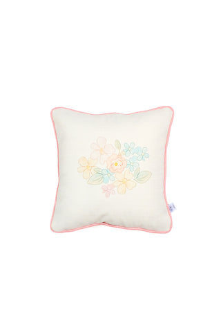 The Precious Petals Children’s Pillow is a square decorative pillow featuring a white background with pink piping along the edges. At its center, you’ll find a pastel floral design with leaves and flowers in yellow, pink, and blue. Made in the USA, this pillow offers double-sided prints for extra versatility and has a small fabric tag on the right side.