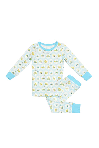 The Buggin’ Out Dream & Play Two Piece Set is a children’s long-sleeve cotton-modal pajama set with light blue trim, featuring yellow and blue smiling suns and clouds on white.