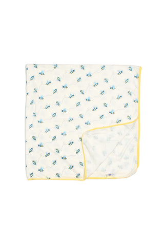 The Buzzin’ Around Children’s Blanket features a white bee print with a yellow border, perfect for kids or as a swaddle. A corner is folded to show the matching bee design and border on the reverse.