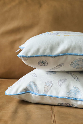 SDS seashell print pillows on leather couch