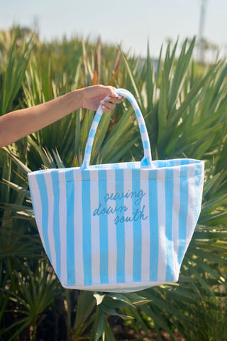 SDS Tote in front of green plants
