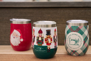 Three festive insulated cups are shown: Santa Claus on the left, the Nutcracker Wine Tumbler in the middle, and a plaid design with a Sewing Down South logo on the right—perfect additions to your Holiday 2024 tumbler collection.