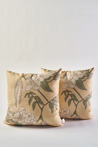 Two Fall Pear Tree Pillows, beige with white flowers and green leaves, create a rustic accent—ideal for autumn decor. Placed side by side on a plain light background.