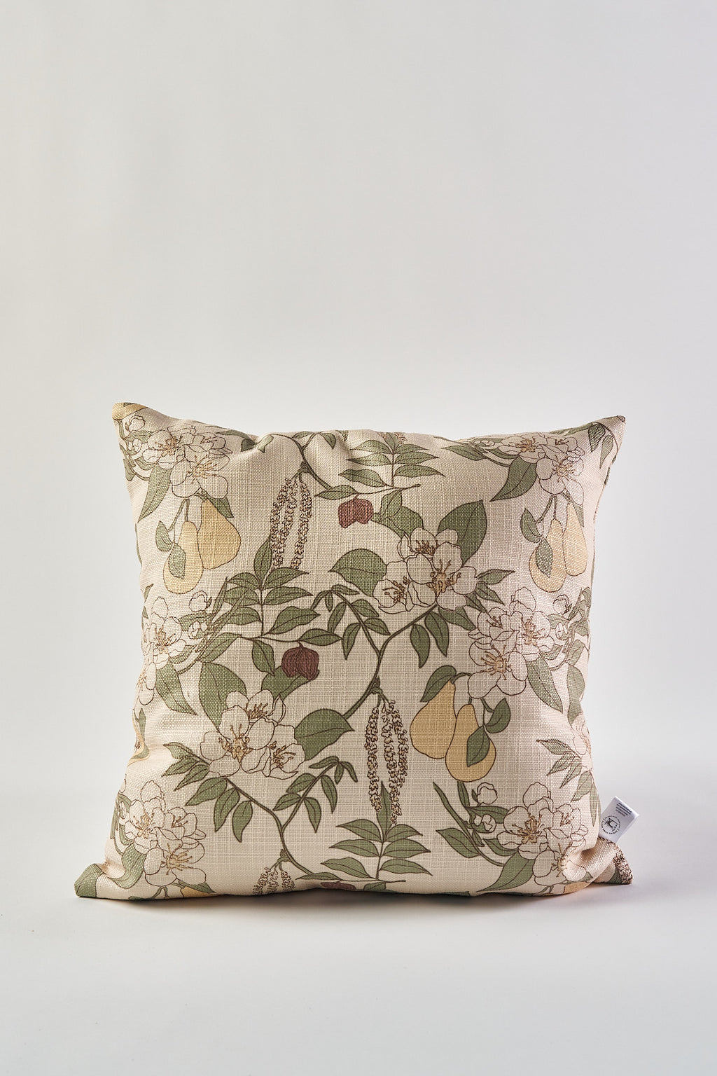 The Fall Florals Pillow, a square pillow with a beige background, displays a green, yellow, brown, and white floral and fruit pattern—making it an ideal rustic accent when placed against a plain white backdrop.