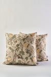 The Fall Florals Pillow features a square design with light beige fabric, green leaves, white flowers, and yellow pears—perfect as a rustic autumn accent against any plain white backdrop.