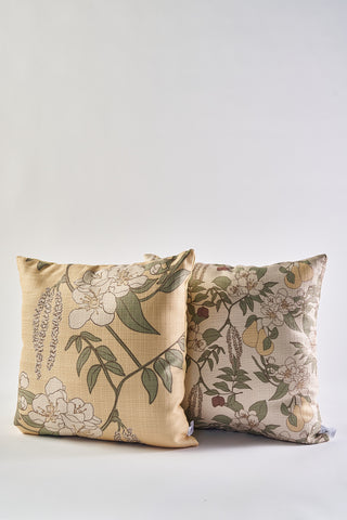 The Fall Florals Pillow features decorative autumn designs with floral and leaf patterns in soft beige, green, and white on a light background. These rustic accent pillows are displayed upright and slightly overlapping for a cozy seasonal touch.