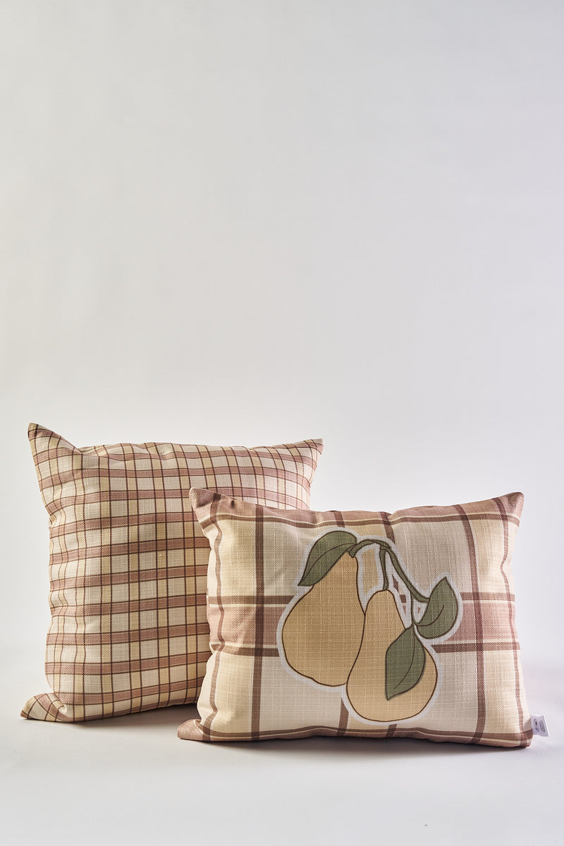 The Fall Tartan Plaid Pillow set includes one with a classic checkered design and another adorned with pears and green leaves, making them cozy accents for your autumn decor.