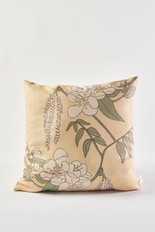 The Fall Pear Tree Pillow is a square beige throw pillow with white flowers and green leaves on thin brown branches, perfect as a rustic accent for autumn decor. Shown here against a plain white background.