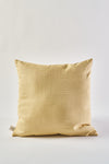 The Fall Pear Tree Pillow, a square accent pillow in light yellow with a rustic textured finish, stands upright against a plain white background. A small fabric tag is visible on the lower left side.