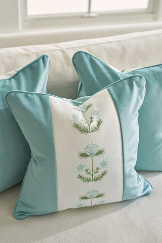 The Bee & Florals Collection: Victorian Floral Stripe Pillow adds a cozy and elegant touch to a living space, featuring blue flowers and green leaves embroidered on a central white panel, perfect for light-colored couches.
