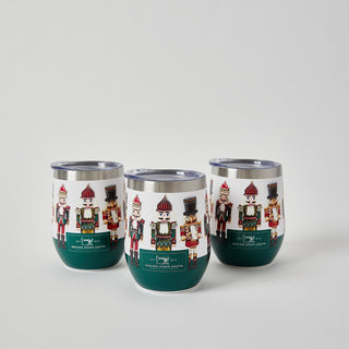 Three Nutcracker Wine Tumblers in festive red, green, and white are arranged in a triangle on a light background—ideal for celebrating Holiday 2024 with Sewing Down South flair.
