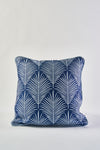 The Oversized Mod Palm Pillow features a navy blue base with a crisp white geometric palm leaf pattern, offering a stylish Southern aesthetic accent to any space. Shown on a plain white background.