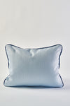 The Mod Flora Lumbar Pillow features a light blue rectangular design with a subtle textured pattern and dark blue piping, bringing modern Southern charm to any stylish space. Perfect as an accent pillow for your home décor.