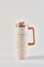 The Pink Lattice 30oz Tumbler features a geometric pink and white design, large orange handle, clear lid, straw, "Sewing Down South" text on front, and an insulated build for a no-sweat exterior and all-day comfort.