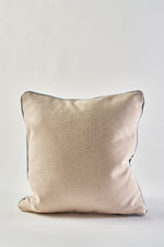 An Oversized Modern Polka Dots Pillow in square shape with beige textured fabric and dark piping, perfect for southern decor, shown against a plain white background.