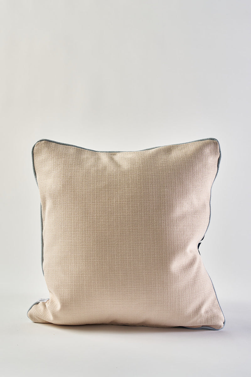 An Oversized Modern Polka Dots Pillow in square shape with beige textured fabric and dark piping, perfect for southern decor, shown against a plain white background.