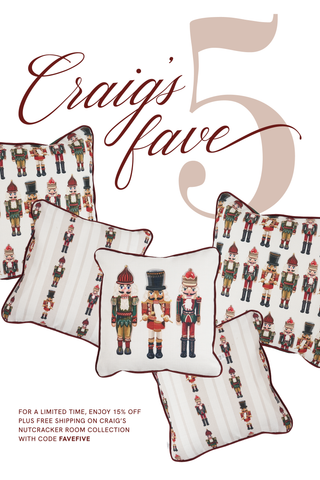Five decorative pillows from the Nutcracker Room Collection, each with a nutcracker design, are scattered. Get 15% off and free shipping on Craig’s Nutcracker Room Collection with code FAVEFIVE.