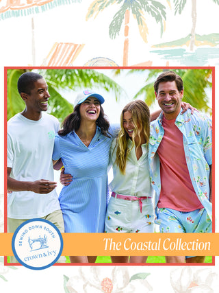 Four people posing together with palm trees and a tropical beach in the background, featuring 'The Coastal Collection' by Tommy Bahama.