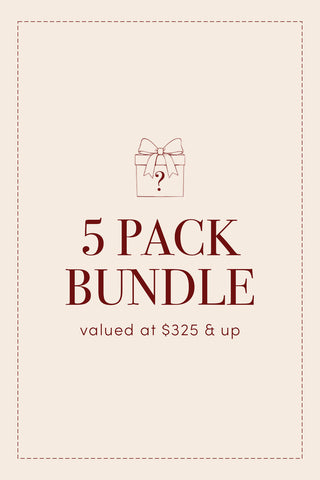 A minimalist graphic features a gift box with a bow above the text “5-PACK Holiday Pillow Cover Mystery Bundle valued at $325 & up” on a beige background framed by a dashed border, suggesting an exclusive collection of festive pillow covers and retired holiday designs.