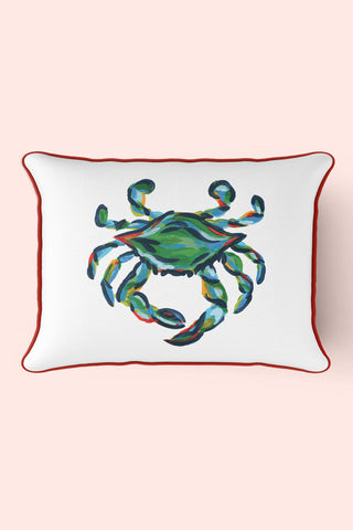 The King Crab Lumbar Pillow displays a vibrant King Crab print on a light pink background, with the crabs blue, green, and orange hues framed by a thin red outline, embodying Sewing Down Souths signature style.