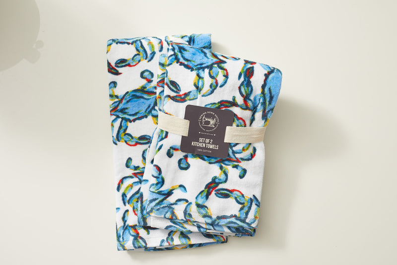The Crab Craze Kitchen Towels, 2 pack features a vibrant blue crab design ideal for coastal kitchen decor, presented on a plain, light background.